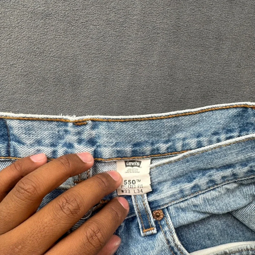 Vintage Levis 550 Relaxed Fit Jeans Light Wash Made in USA 33x34 Distressed